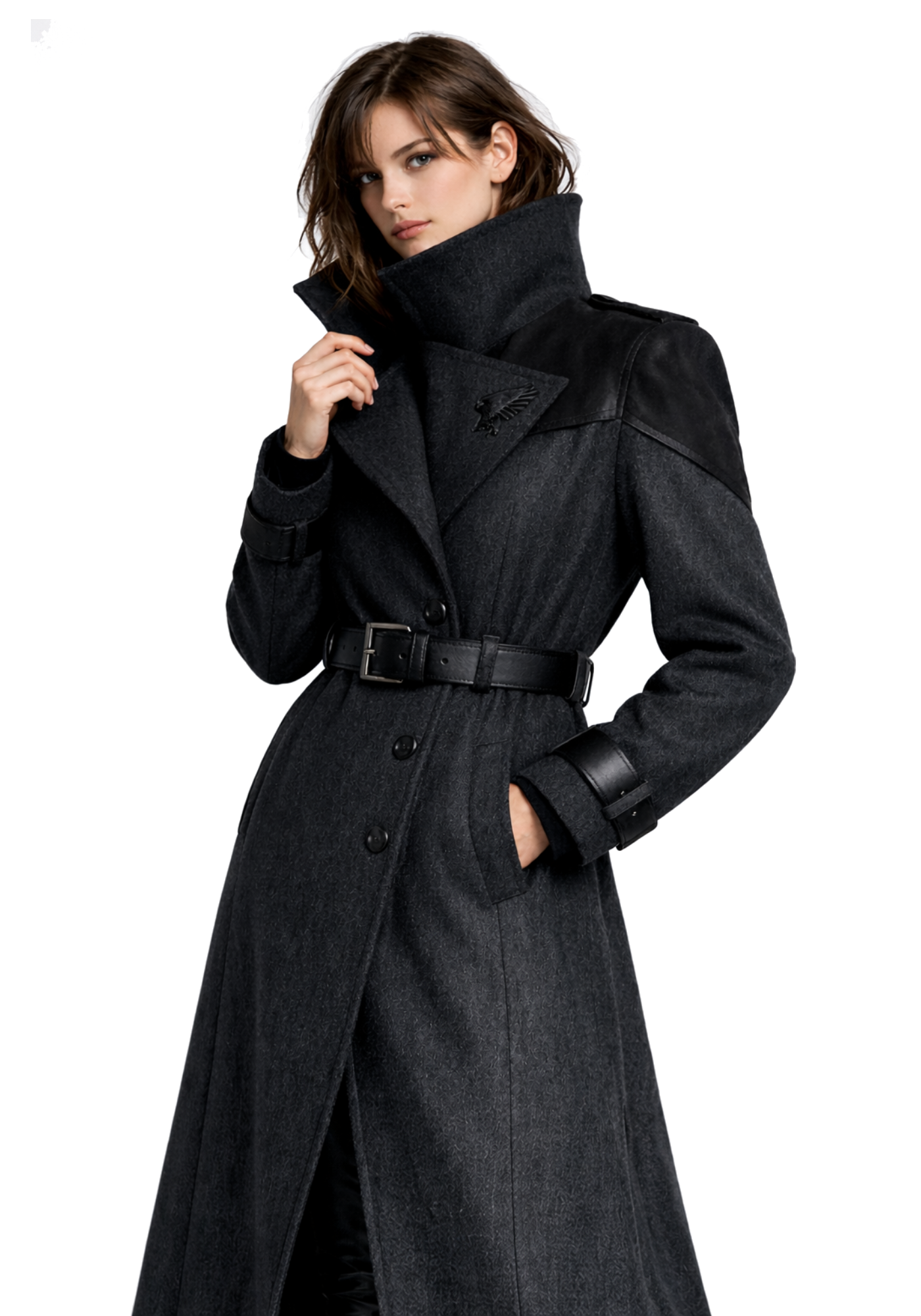 Woman wearing a long black patterned trench coat with high stand collar, button front, wide buckle belt, angled pockets, and belted cuffs